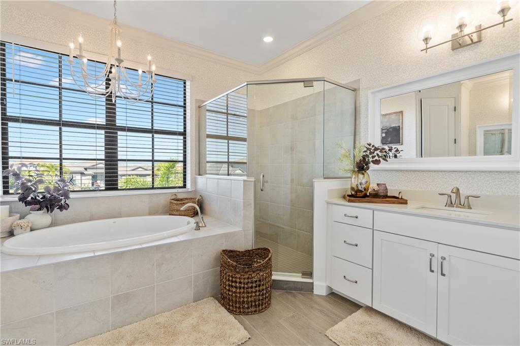 20507 Napa Loop Estero, FL 33928 - Photo 34 of 49 a spacious bathroom with a double vanity sink mirror and bathtub