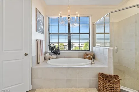 a bathroom with a bathtub and shower