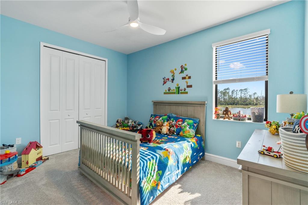 20507 Napa Loop Estero, FL 33928 - Photo 40 of 49 a bedroom with a bed and a window