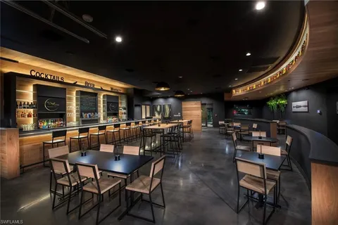 a dining space with furniture and a potted plant