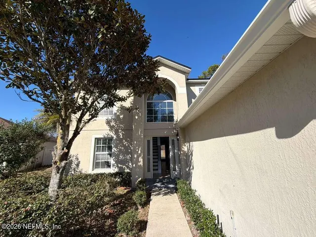 a house with trees in front of it