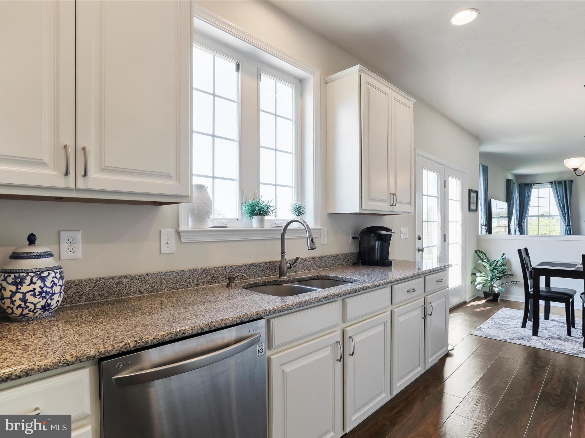 1147 Fox Run Terrace Hanover, PA 17331 - Photo 11 of 50 a kitchen with stainless steel appliances granite countertop a sink a stove cabinets and wooden floor