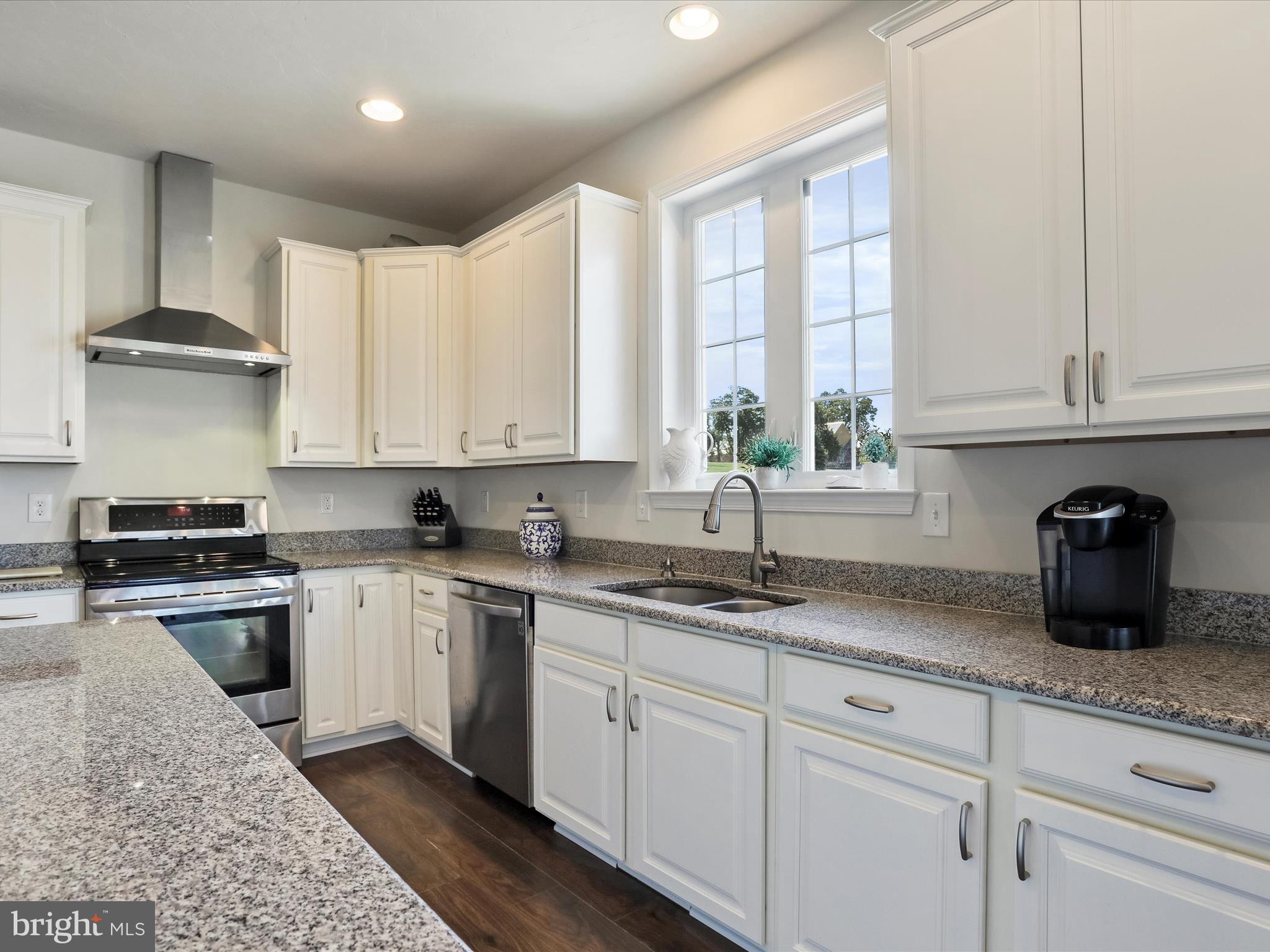 1147 Fox Run Terrace Hanover, PA 17331 - Photo 12 of 50 a kitchen with granite countertop a sink stainless steel appliances and cabinets