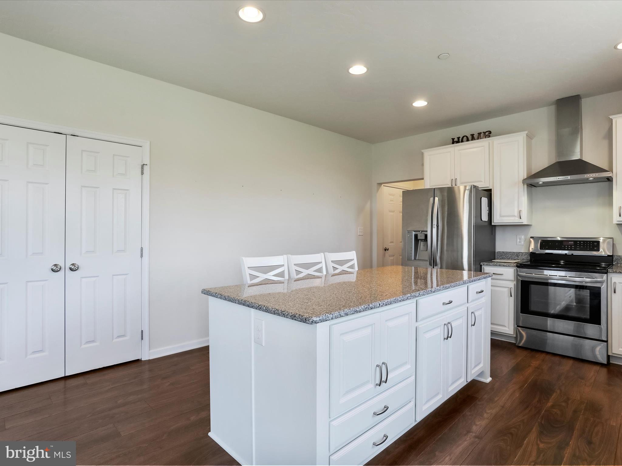 1147 Fox Run Terrace Hanover, PA 17331 - Photo 14 of 50 a kitchen with white cabinets and white appliances