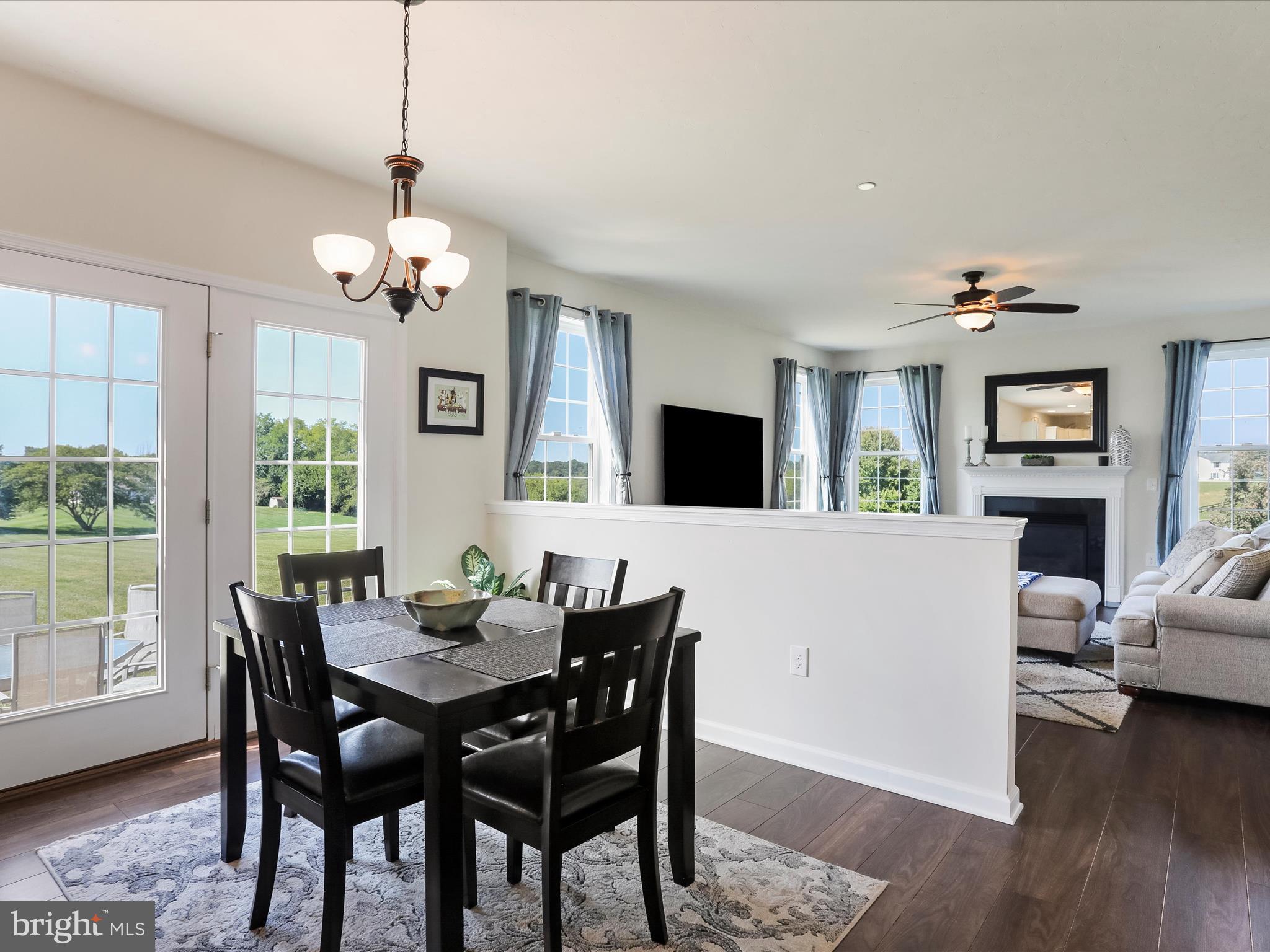 1147 Fox Run Terrace Hanover, PA 17331 - Photo 18 of 50 a view of a dining room with furniture a chandelier and wooden floor