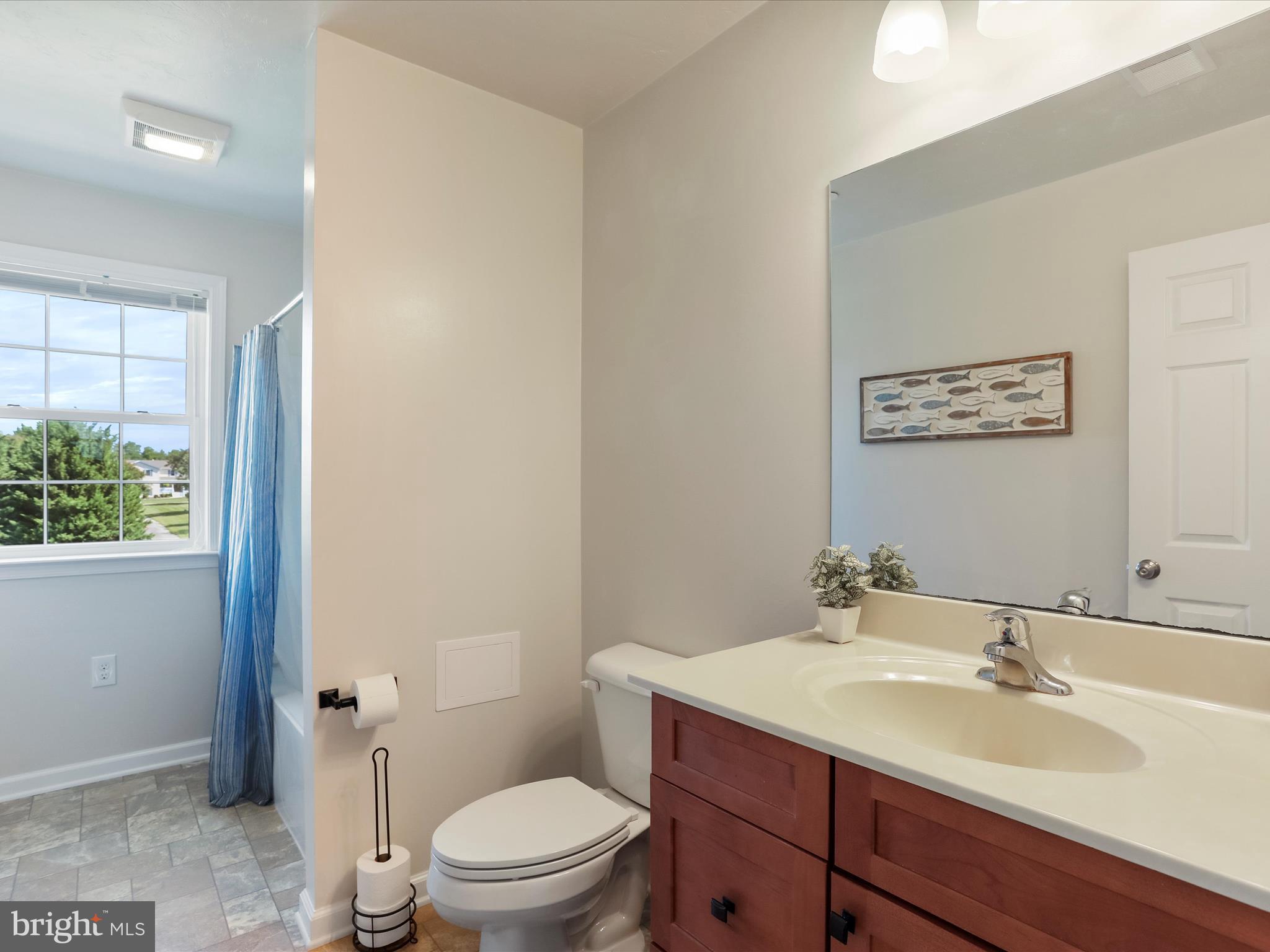 1147 Fox Run Terrace Hanover, PA 17331 - Photo 23 of 50 a bathroom with a toilet a sink and mirror