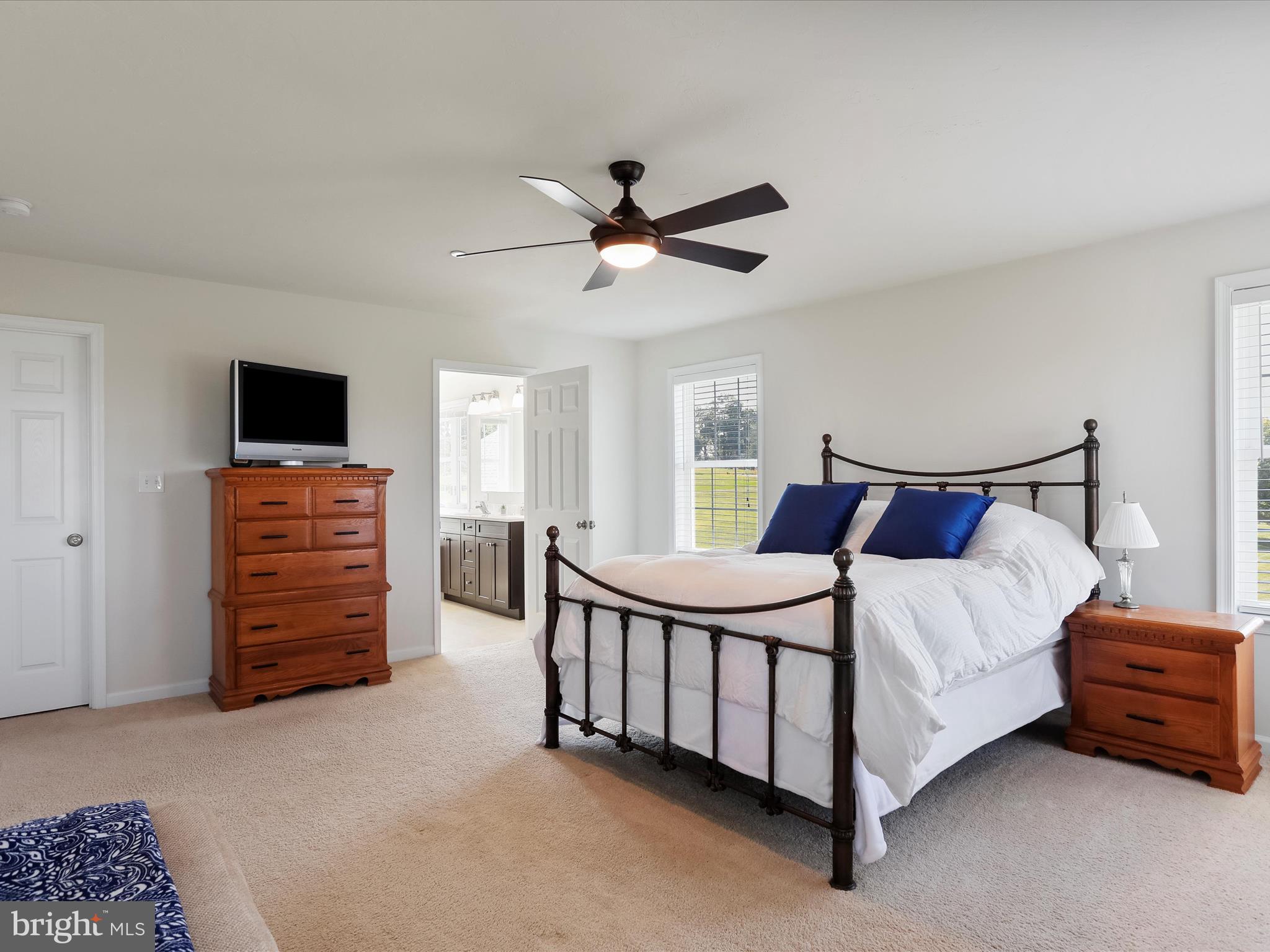 1147 Fox Run Terrace Hanover, PA 17331 - Photo 30 of 50 a bedroom with a bed a dresser and a chandelier