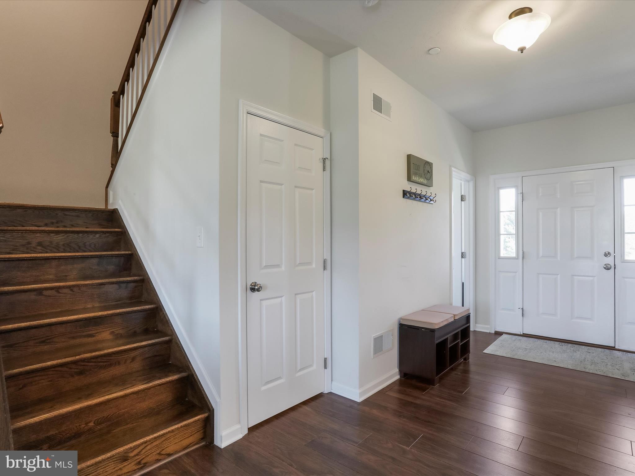 1147 Fox Run Terrace Hanover, PA 17331 - Photo 6 of 50 a view of a hallway with wooden floor and staircase