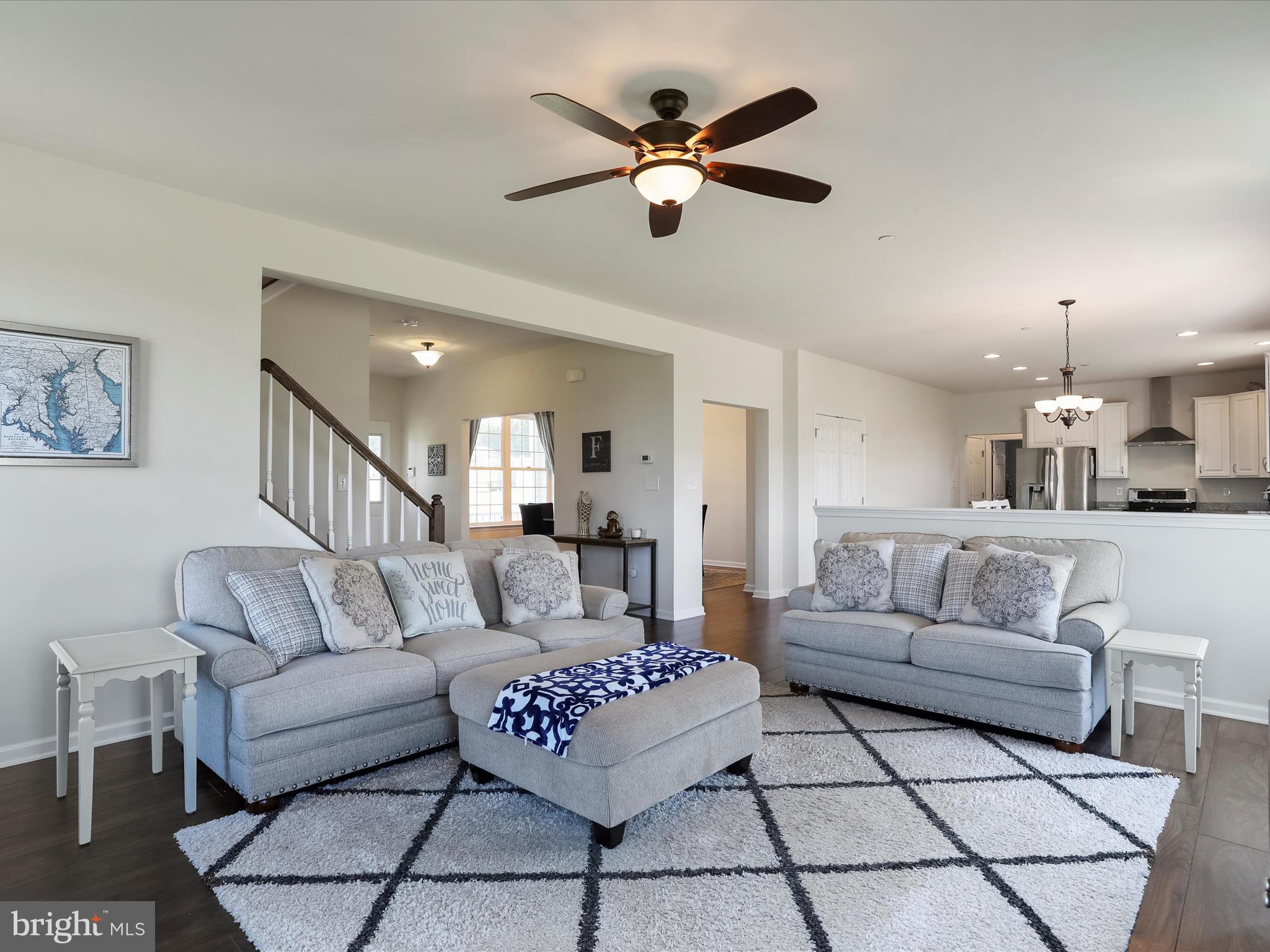 1147 Fox Run Terrace Hanover, PA 17331 - Photo 9 of 50 a living room with furniture and a chandelier