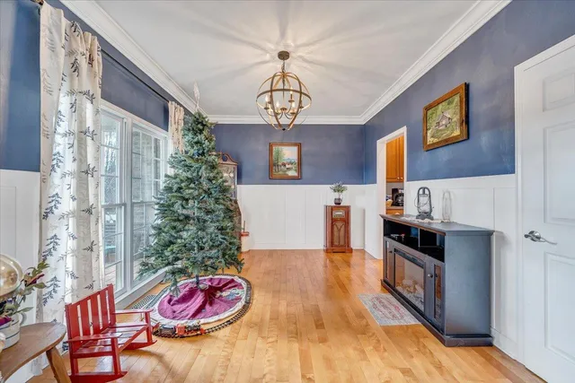 a bedroom with a bed and a dresser in it