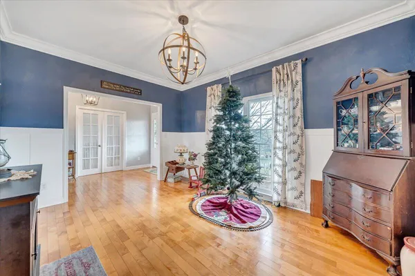 a dining room with furniture window wooden floor