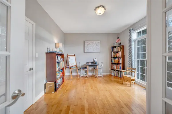 a view of a dining room with furniture window and wooden floor