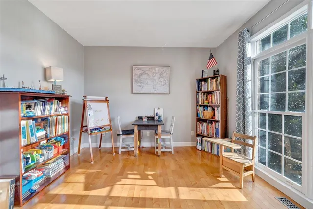 a bath tub sitting in a bathroom next to a window