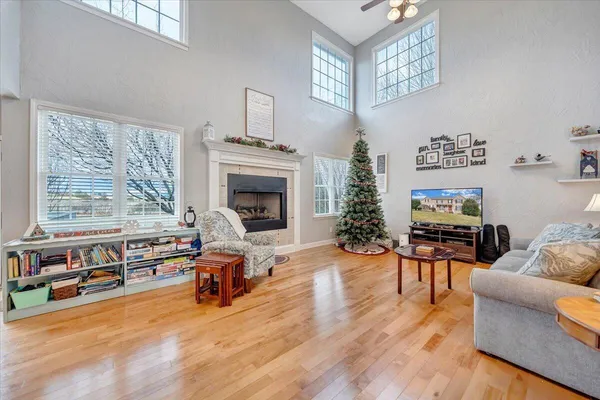 a view of a workspace with furniture and a window
