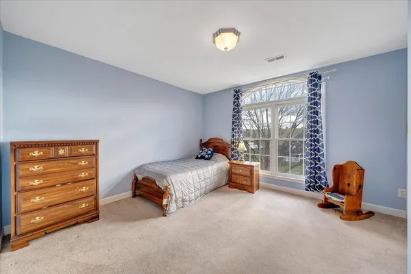 a very nice looking living room with wooden floor and furniture
