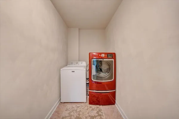 an aerial view of a house a yard and lake view