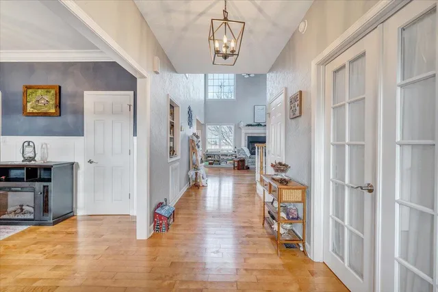 a bathroom with a granite countertop sink vanity mirror and toilet