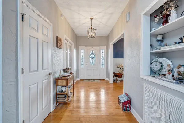 a kitchen with stainless steel appliances granite countertop wooden cabinets a stove top oven a sink and dishwasher
