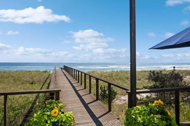 a view of a balcony next to a lake view