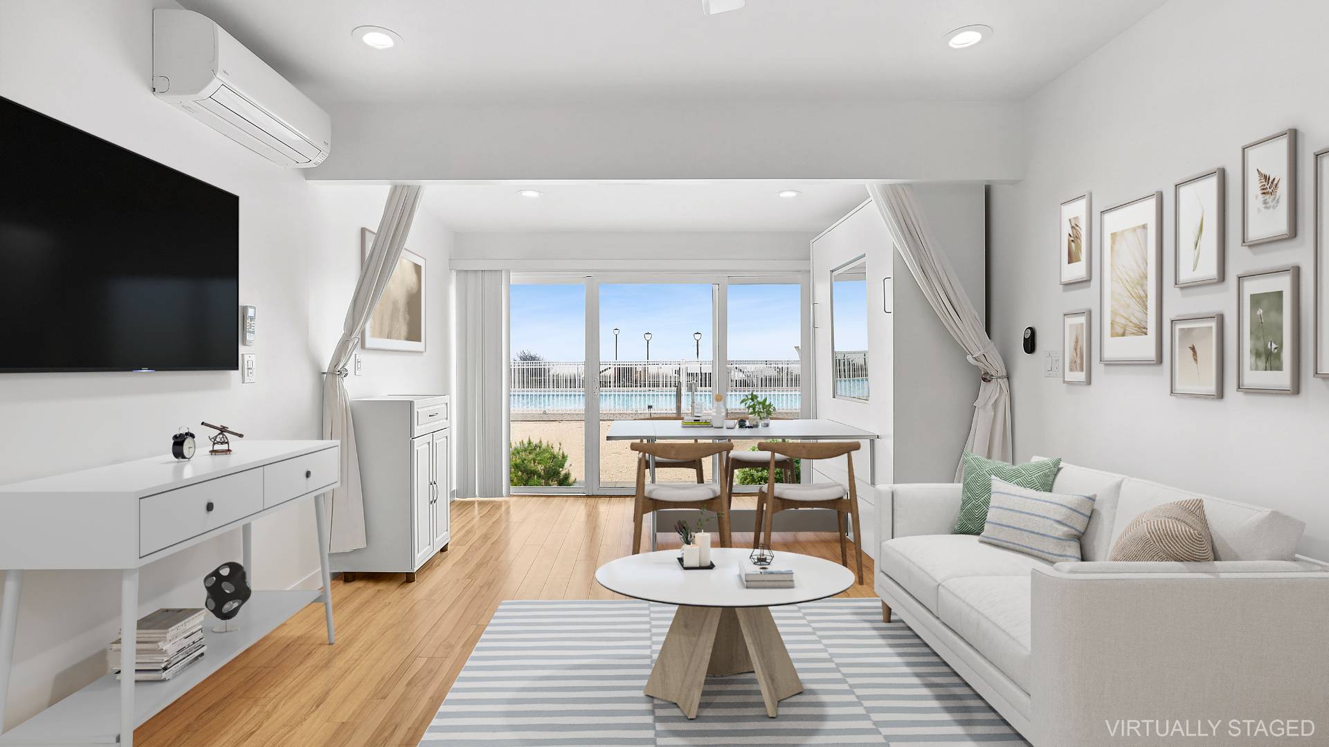 585 Dune Road Westhampton, NY 11978 - Photo 4 of 16 a living room with furniture and a flat screen tv
