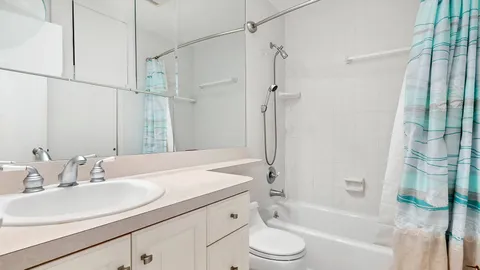 a bathroom with a sink a toilet and a bathtub