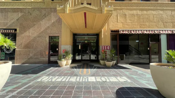 a view of a building with sitting area