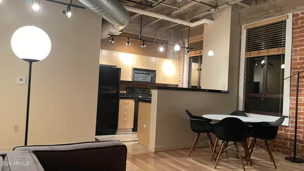 a kitchen with a table and chairs