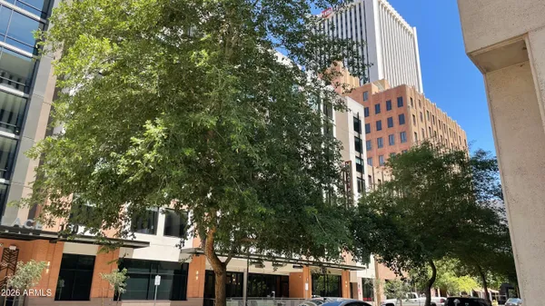 a view of a building with a tree