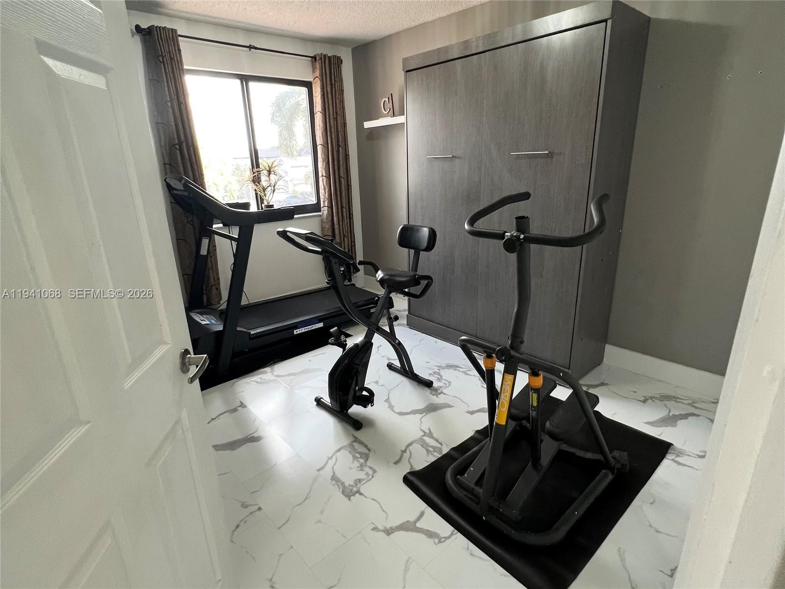 8618 Southwest 161st Place Miami, FL 33193 - Photo 22 of 33 a bathroom with a sink and a mirror