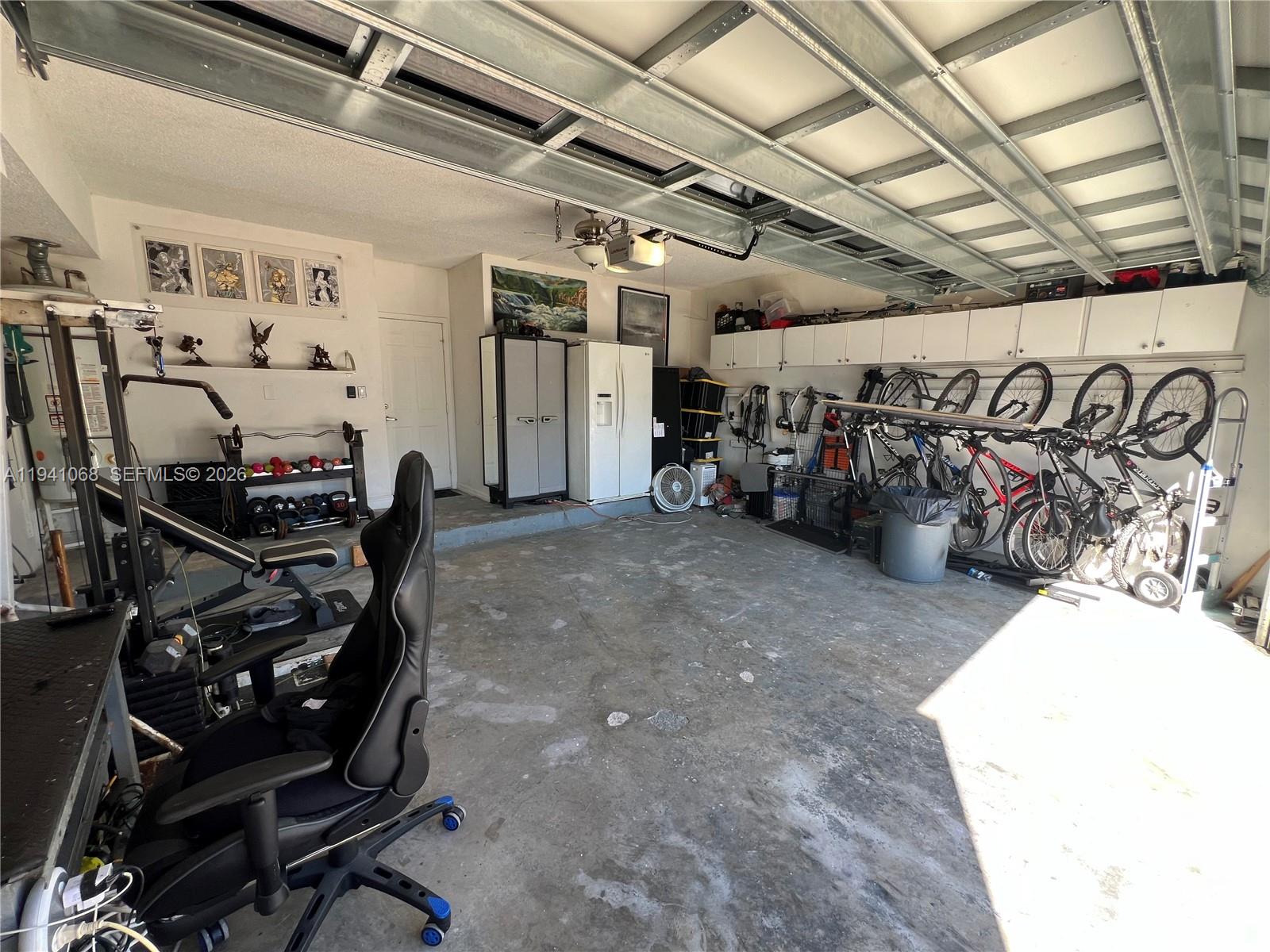 8618 Southwest 161st Place Miami, FL 33193 - Photo 32 of 33 a view of a room with gym equipment