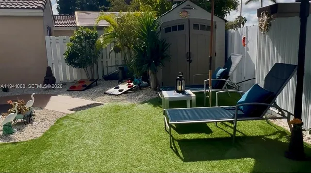 a view of a chairs and tables in the patio