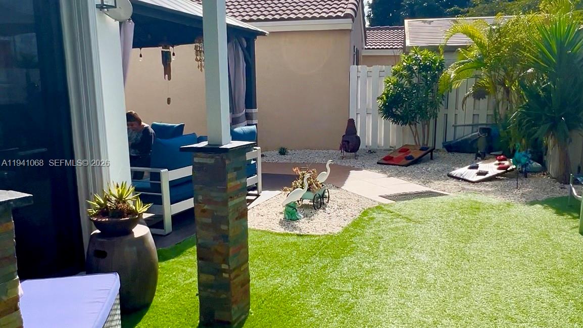 8618 Southwest 161st Place Miami, FL 33193 - Photo 6 of 33 a view of backyard of a house with seating space