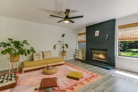 a living room with furniture and a fireplace