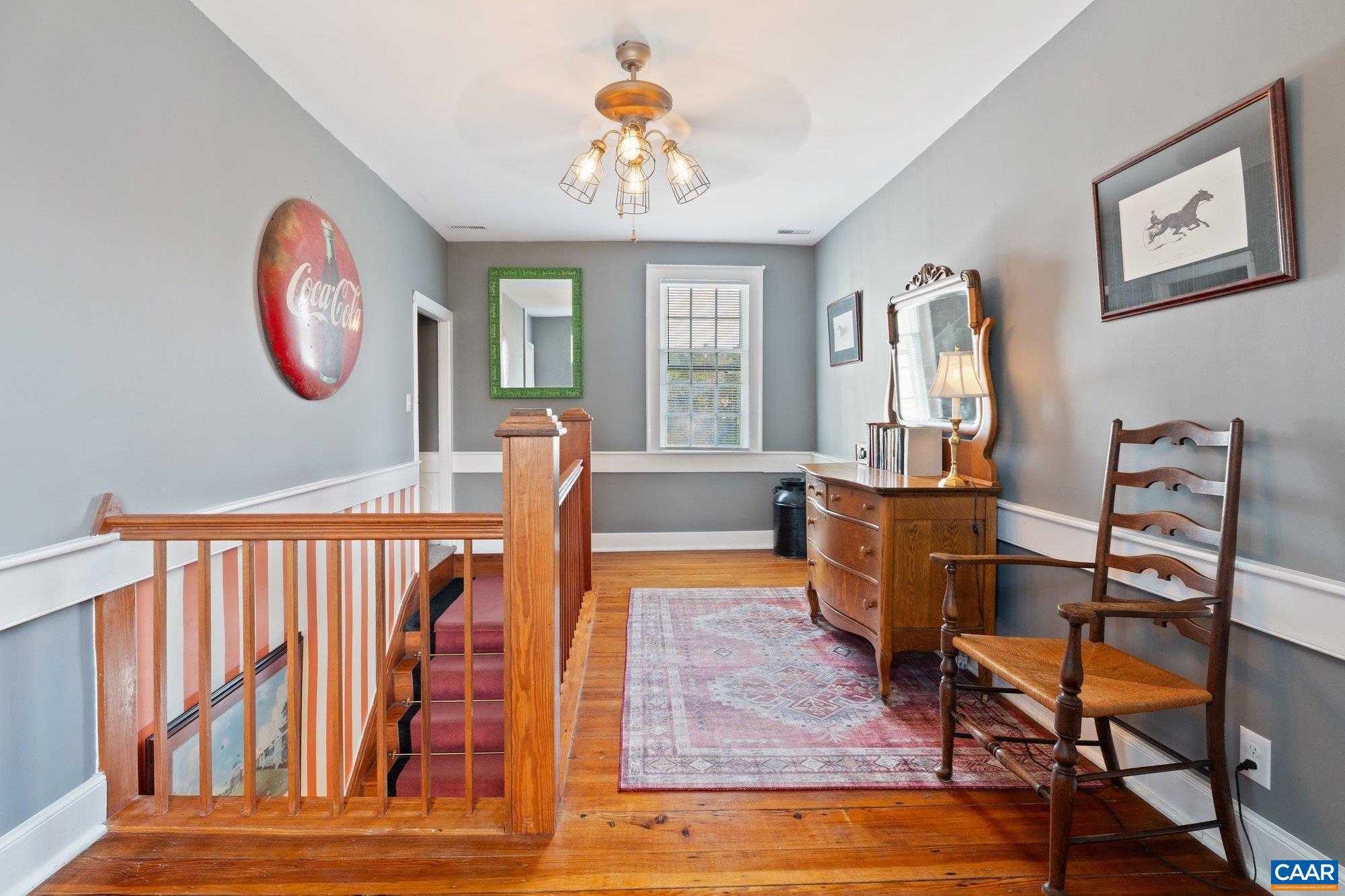 14910 Western Mill Road Lawrenceville, VA 23868 - Photo 36 of 73 a view of a dining room with furniture a chandelier and wooden floor