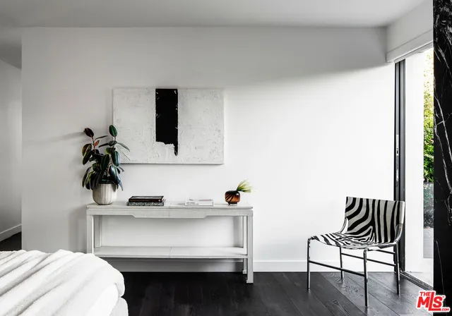 a bathroom with a granite countertop shower a sink and a mirror