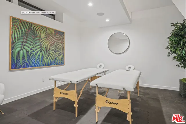 a room with gym equipment and a view of living room