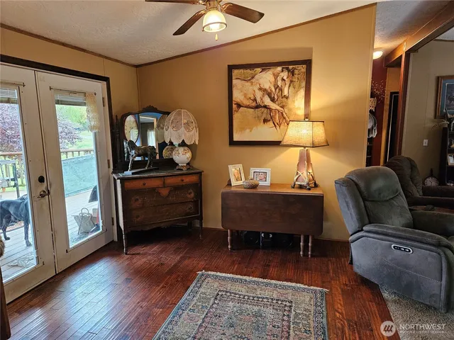 a bedroom with furniture and wooden floor