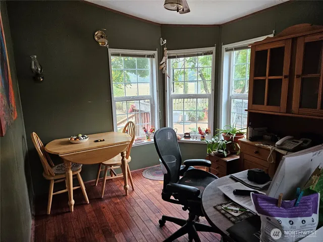 a view of a dining room with furniture window and outside view