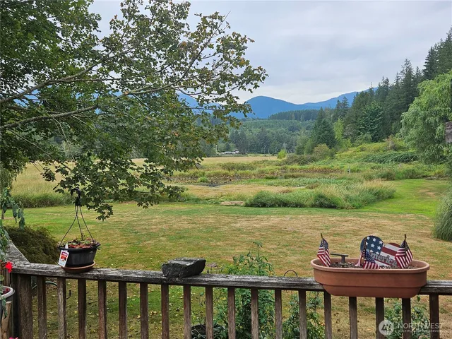 a view of a lake with a mountain from a lake