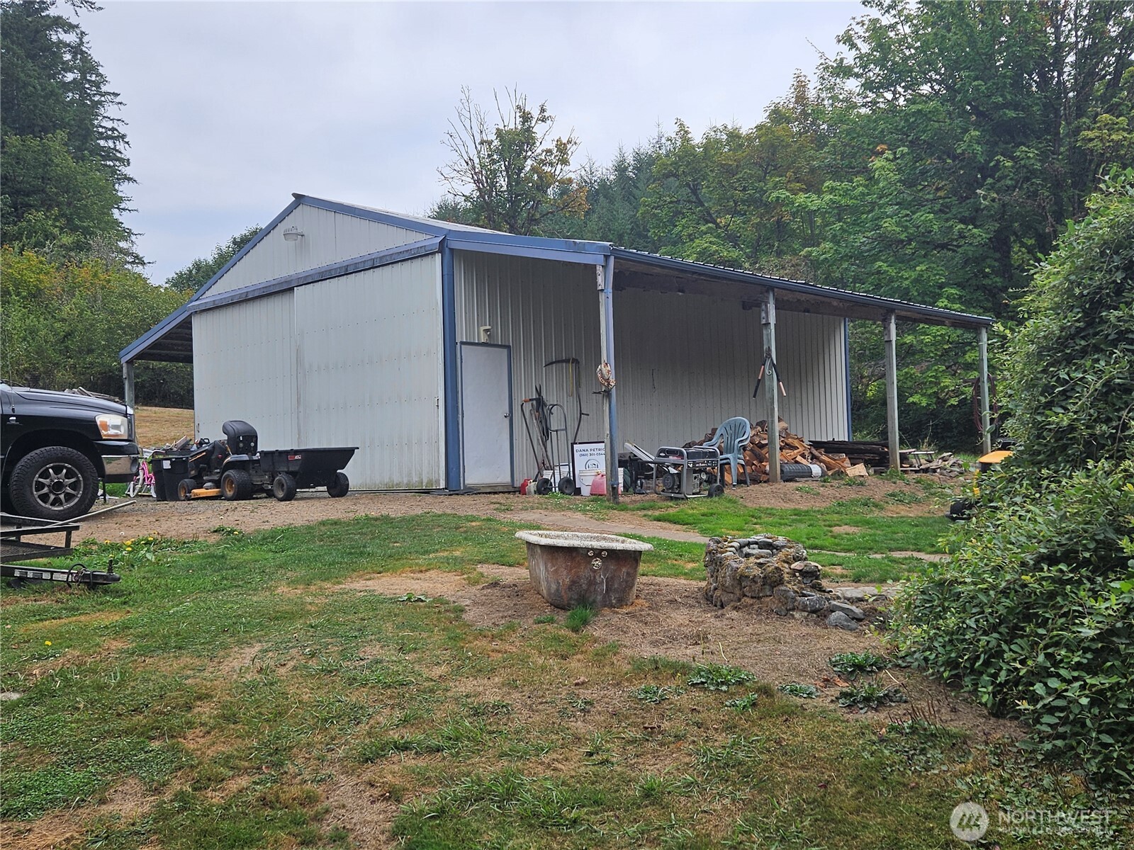50 Leland Cut-Off Road Quilcene, WA 98376 - Photo 8 of 23 a front view of a house with garden