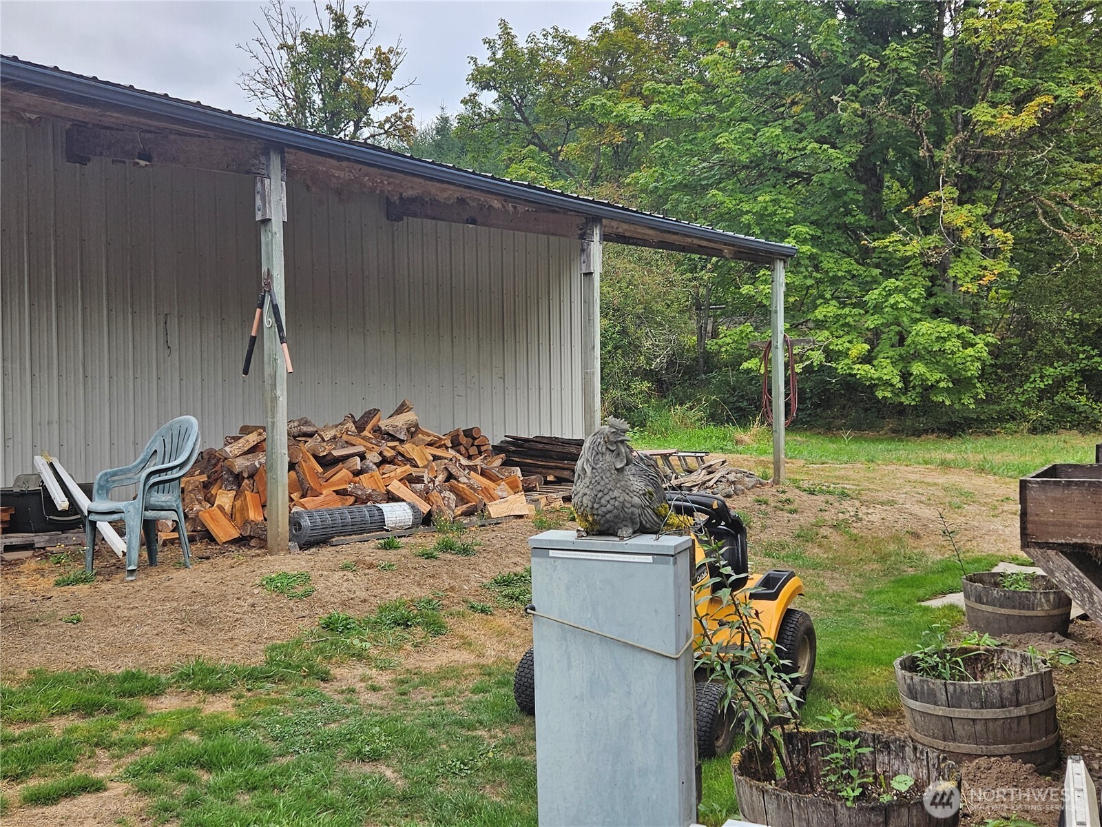 50 Leland Cut-Off Road Quilcene, WA 98376 - Photo 9 of 23 a view of a patio with chairs and potted plants