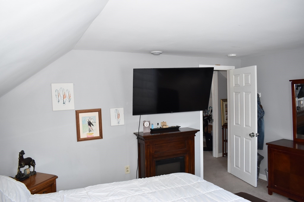 13 Charles Place Athol, MA 01331 - Photo 18 of 31 a bedroom with a bed and a flat screen tv