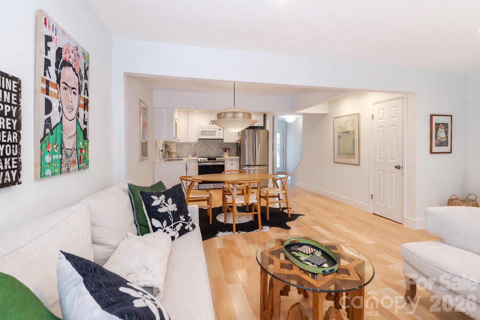 6622 Thermal Road Charlotte, NC 28211 - Photo 17 of 36 a view of a dining room with furniture a kitchen and chandelier