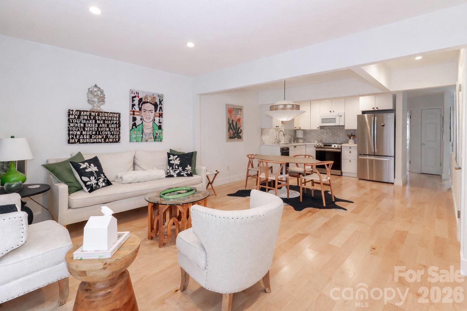 6622 Thermal Road Charlotte, NC 28211 - Photo 18 of 36 a living room with furniture a rug and a table