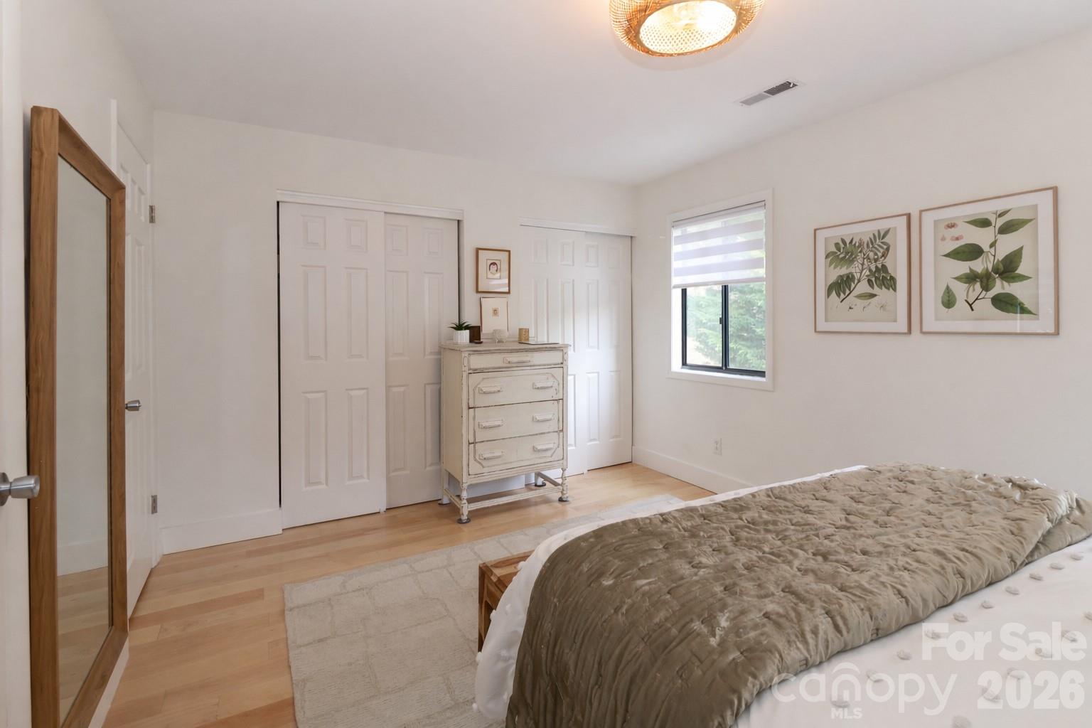 6622 Thermal Road Charlotte, NC 28211 - Photo 21 of 36 a bedroom with a bed and a cabinets