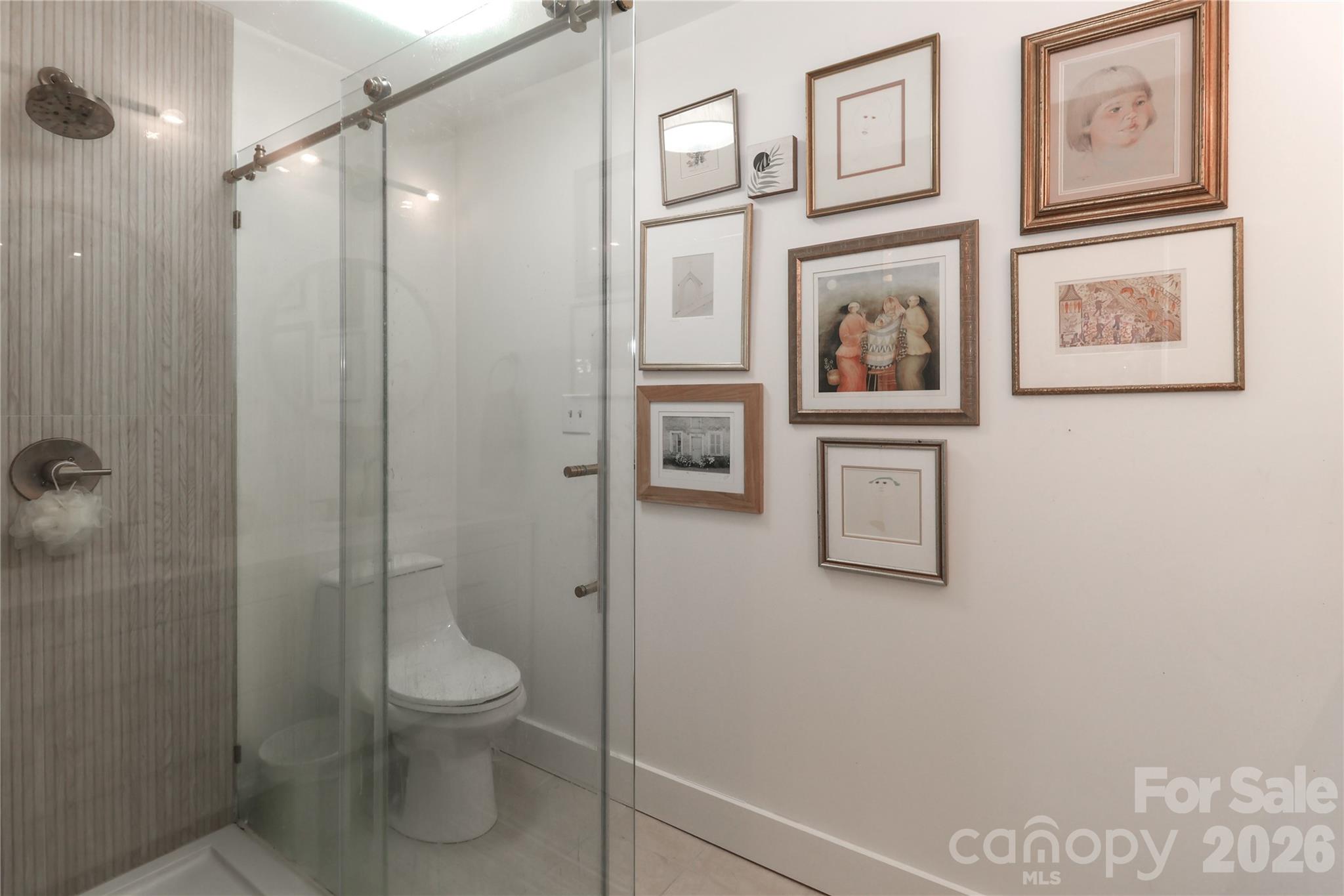 6622 Thermal Road Charlotte, NC 28211 - Photo 25 of 36 a bathroom with a toilet and a shower