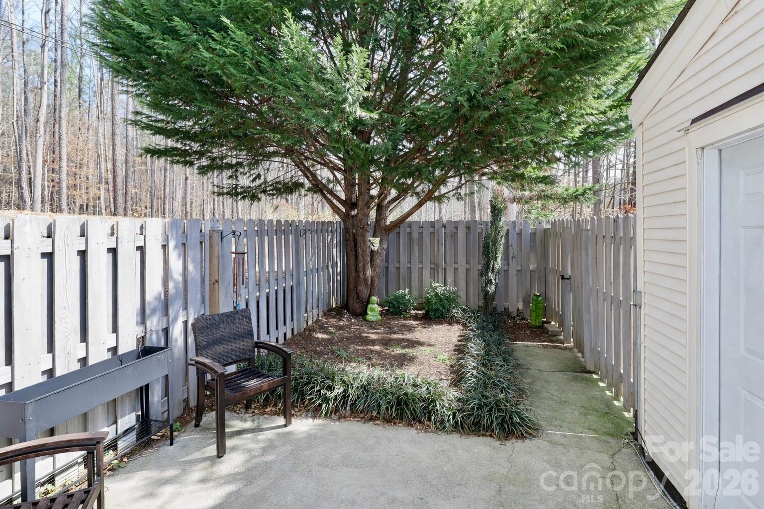 6622 Thermal Road Charlotte, NC 28211 - Photo 32 of 36 a backyard of a house with table and chairs