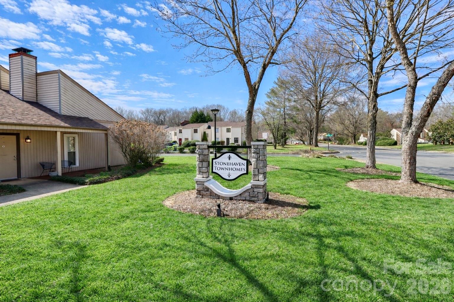6622 Thermal Road Charlotte, NC 28211 - Photo 35 of 36 a view of a backyard with table and chairs and a large tree