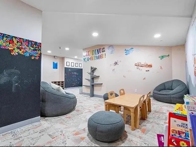 a living room with furniture and a rug