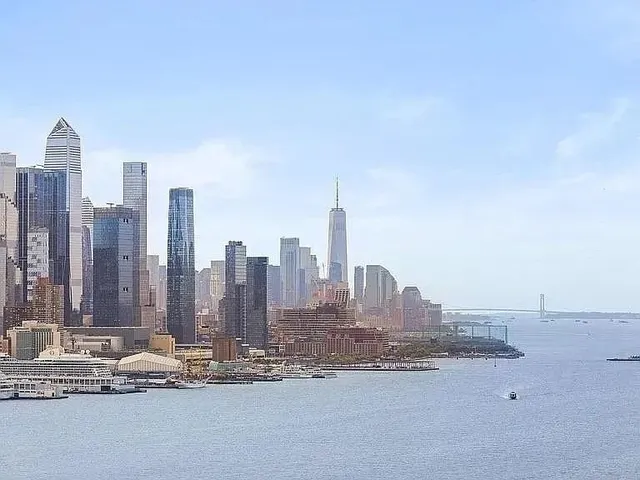a view of a city with tall buildings in the background